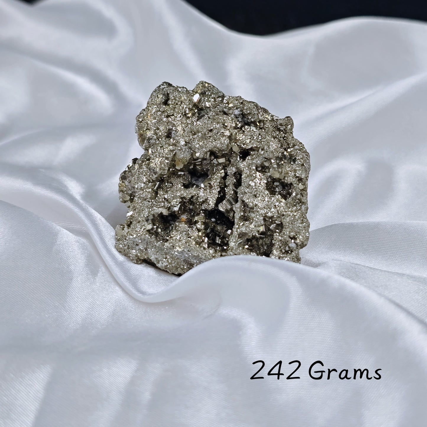 Handheld Energised Pyrite Rough showing size and positive energy flow