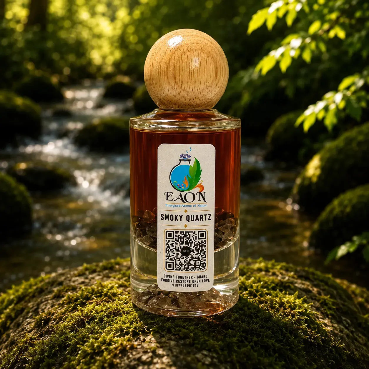 Bottle of EAN Smoky Quartz perfume with a wooden cap on a mossy rock by a stream.