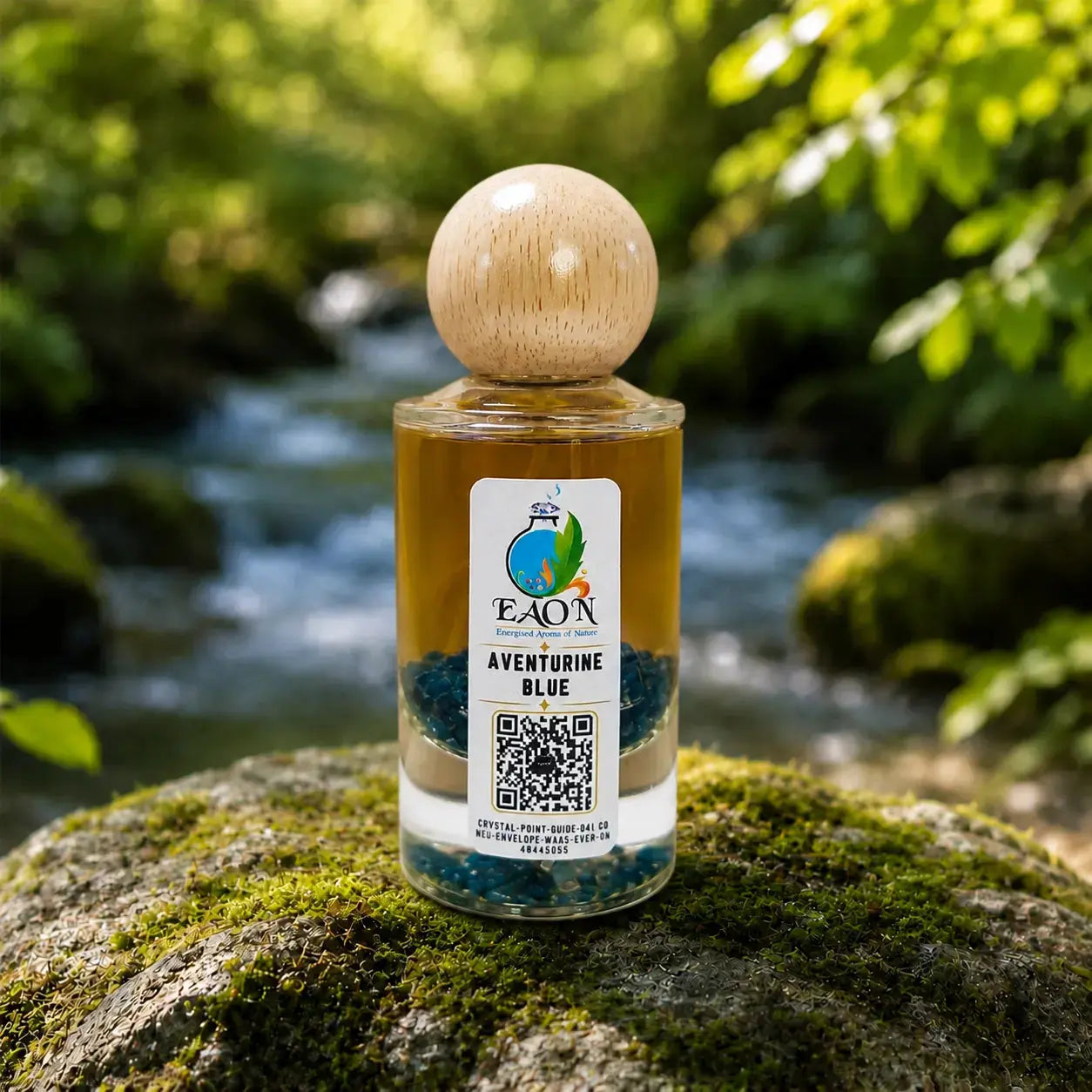 Bottle of FAON Aventurine Blue on a mossy rock with a natural background