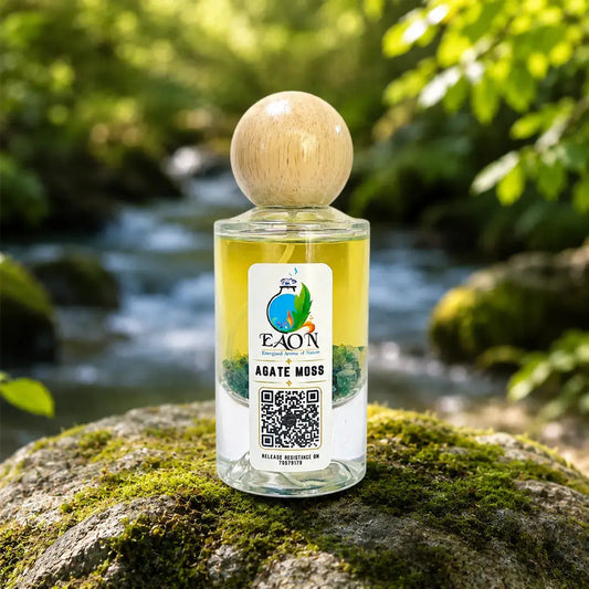 Bottle of Agate Moss product by EAON on a mossy rock with a natural background