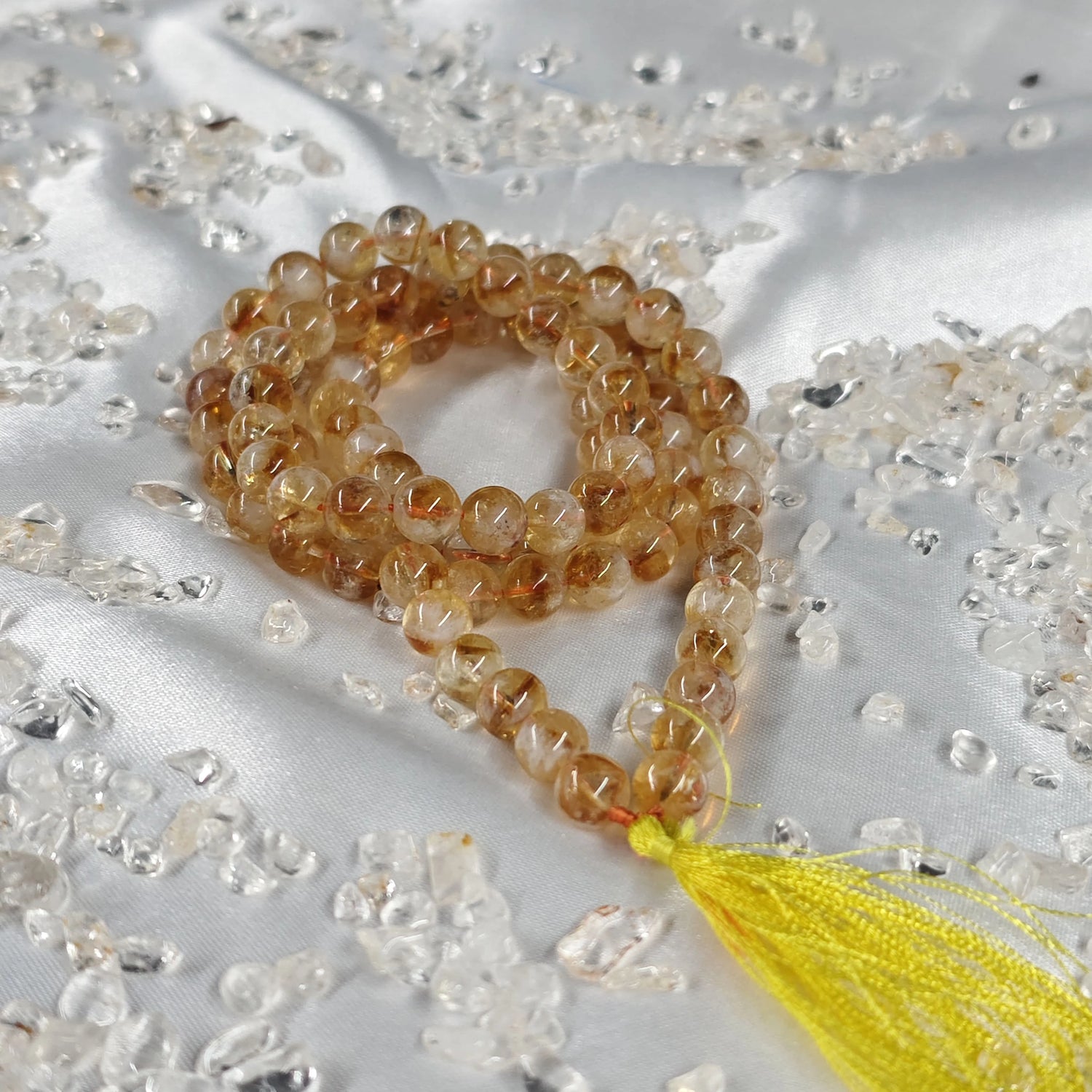 Energised 108 & 54-Bead Citrine Japa Mala by THE GEM’Z handcrafted with natural citrine beads to attract abundance, positivity, and prosperity.
