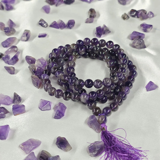 Energised Amethyst Japa Mala by THE GEM’Z handcrafted with natural amethyst beads to awaken inner wisdom, enhance mindfulness, and support meditation.

