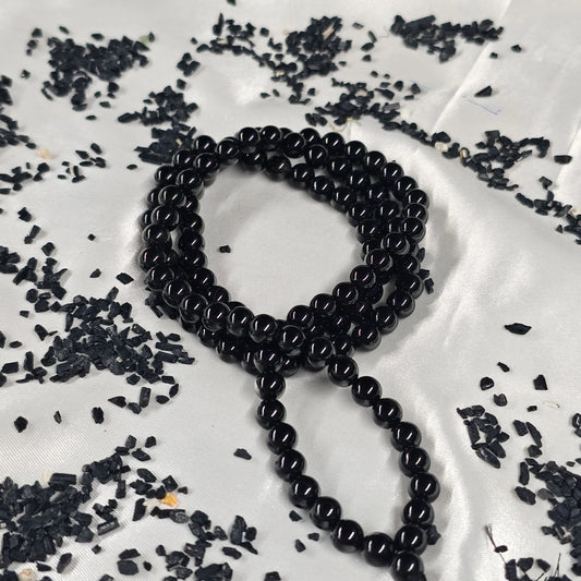 Energised Black Tourmaline Japa Mala by THE GEM’Z handcrafted with natural black tourmaline beads for grounding, protection, and purification.
