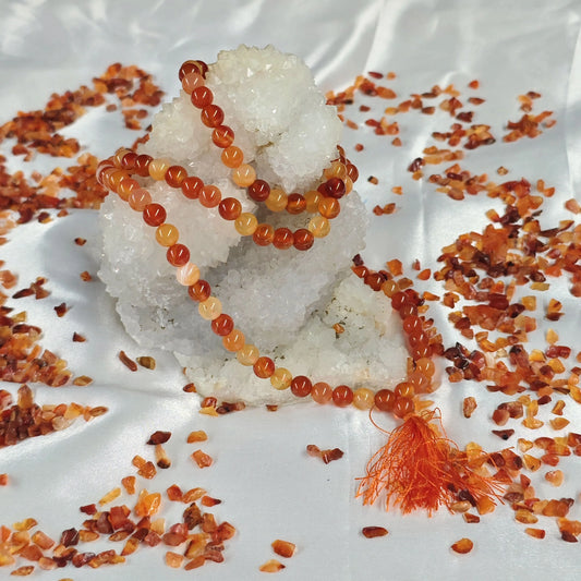 Energised Carnelian Japa Mala by THE GEM’Z showing natural carnelian beads for meditation, focus, and inspiration.
