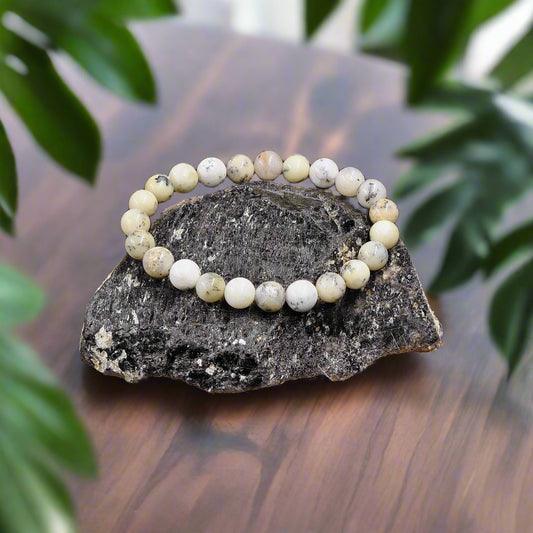 THE GEM’Z Energised Dendritic Opal Bracelet supports growth, inner clarity, and spiritual insight. Handcrafted with natural opal for balance and guidance.
