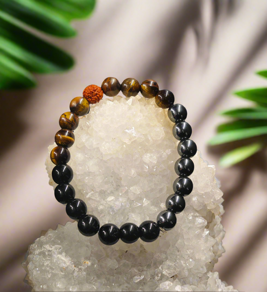 Energised Natural Shield Bracelet by THE GEM’Z handcrafted with Black Tourmaline, Hematite, and Tiger’s Eye to promote protection, positivity, and balanced energy.

