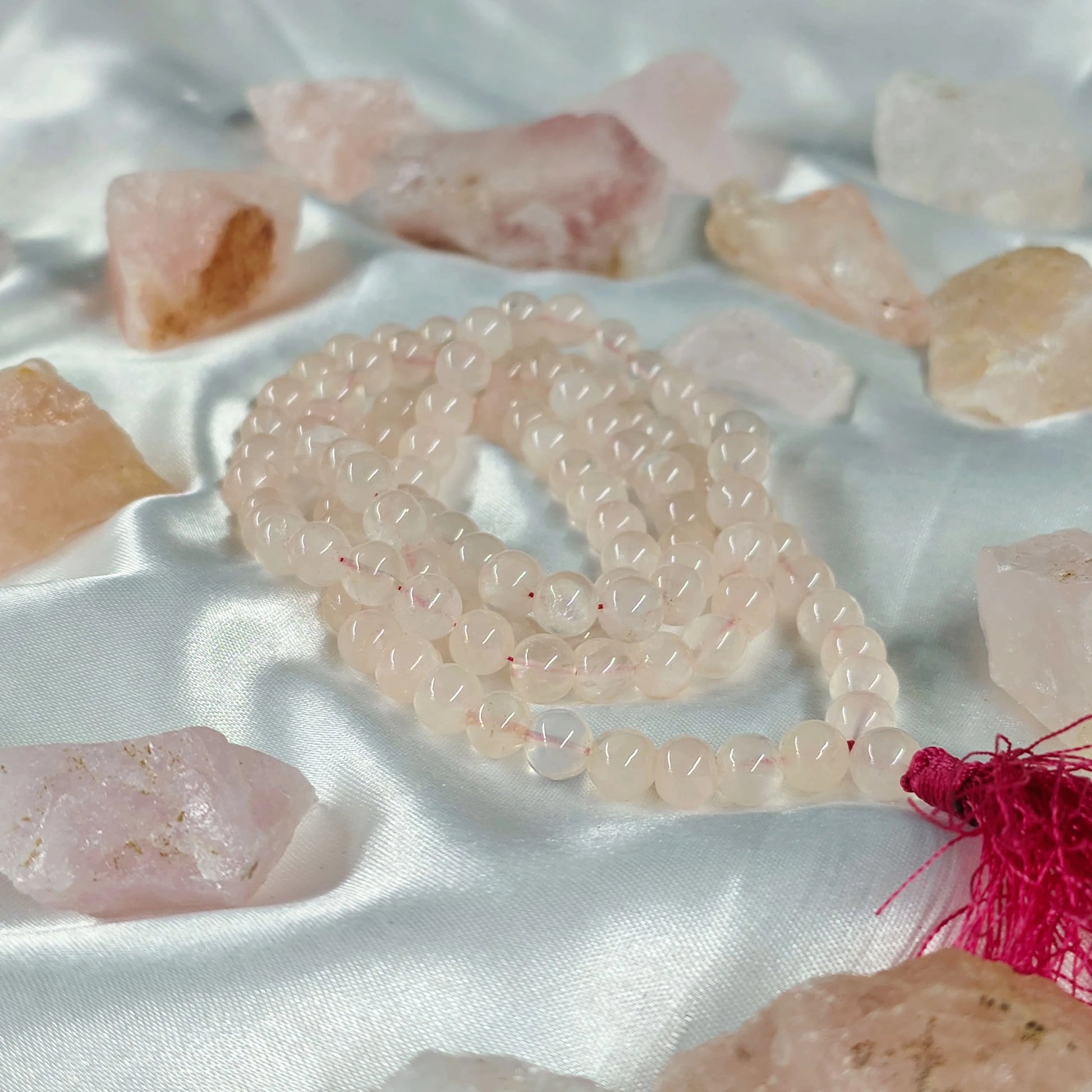 Energised Rose Quartz Japa Mala by THE GEM’Z handcrafted with natural rose quartz beads to promote love, emotional healing, and heart energy.
