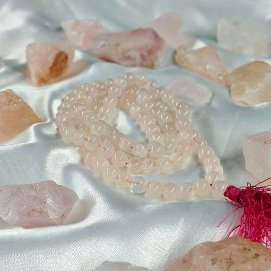 Energised Rose Quartz Japa Mala by THE GEM’Z handcrafted with natural rose quartz beads to promote love, emotional healing, and heart energy.
