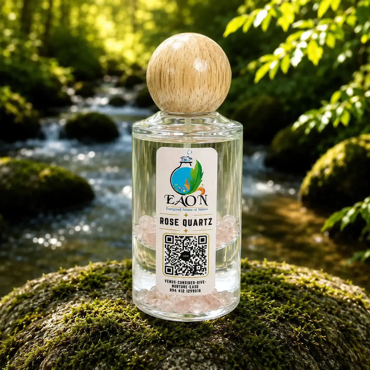 EAON Rose Quartz essential Eaon bottle on a mossy rock with a natural background