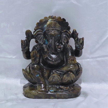 Ganesha idol carved from single piece natural spectrolite gemstone