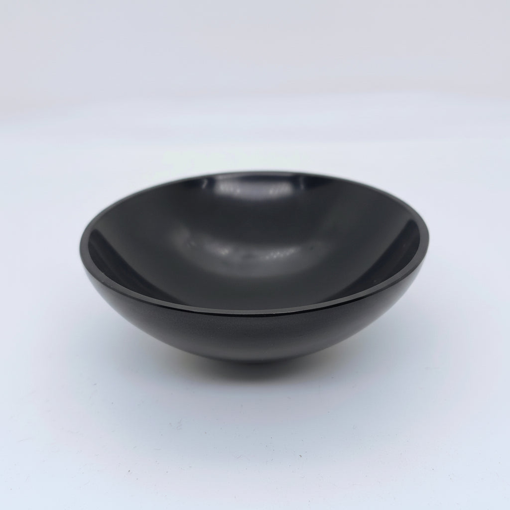 Natural black onyx energy bowl for pooja crystal storage and grounding
