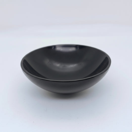 Natural black onyx energy bowl for pooja crystal storage and grounding

