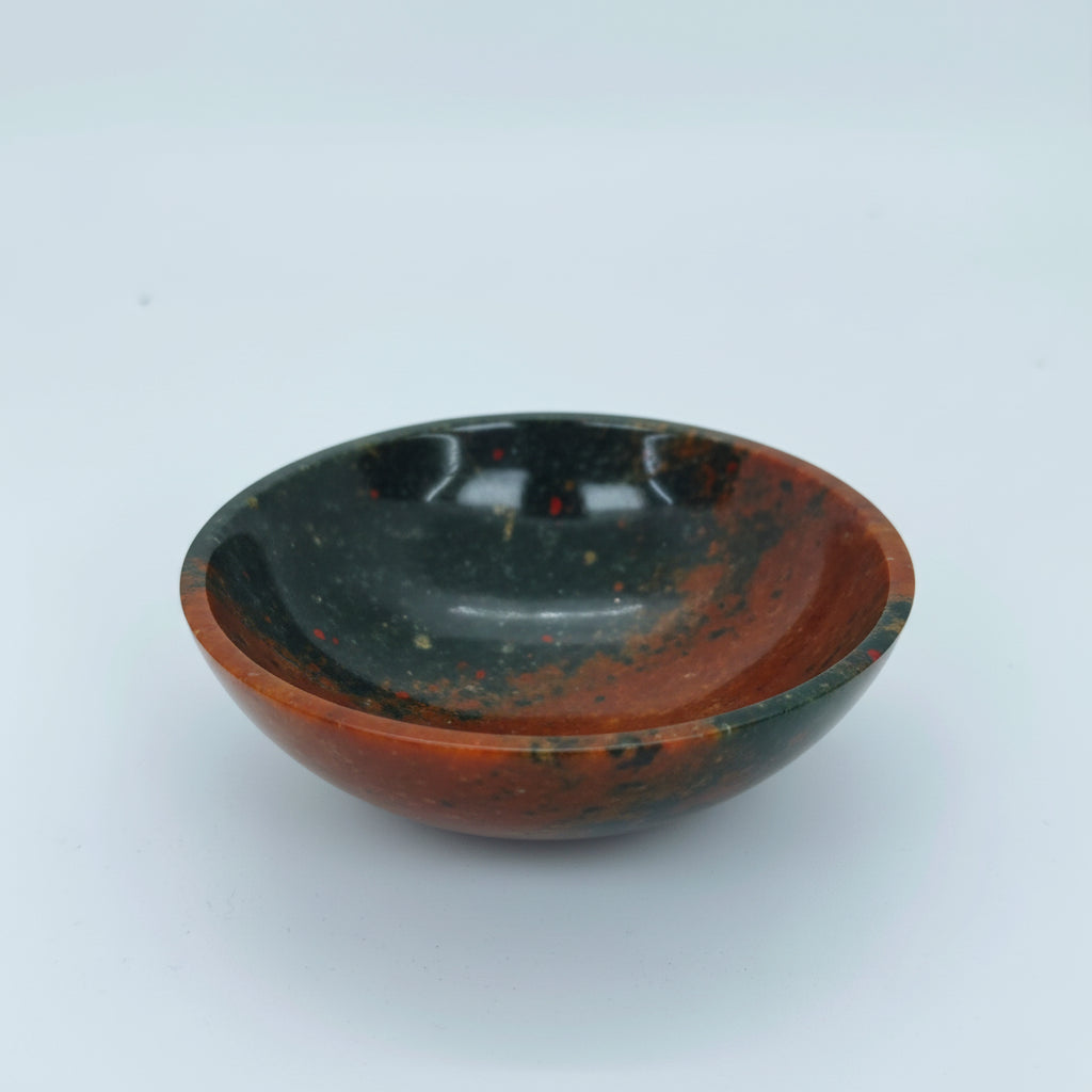 Polished natural bloodstone stone bowl with green and red patterns for vastu and meditation
