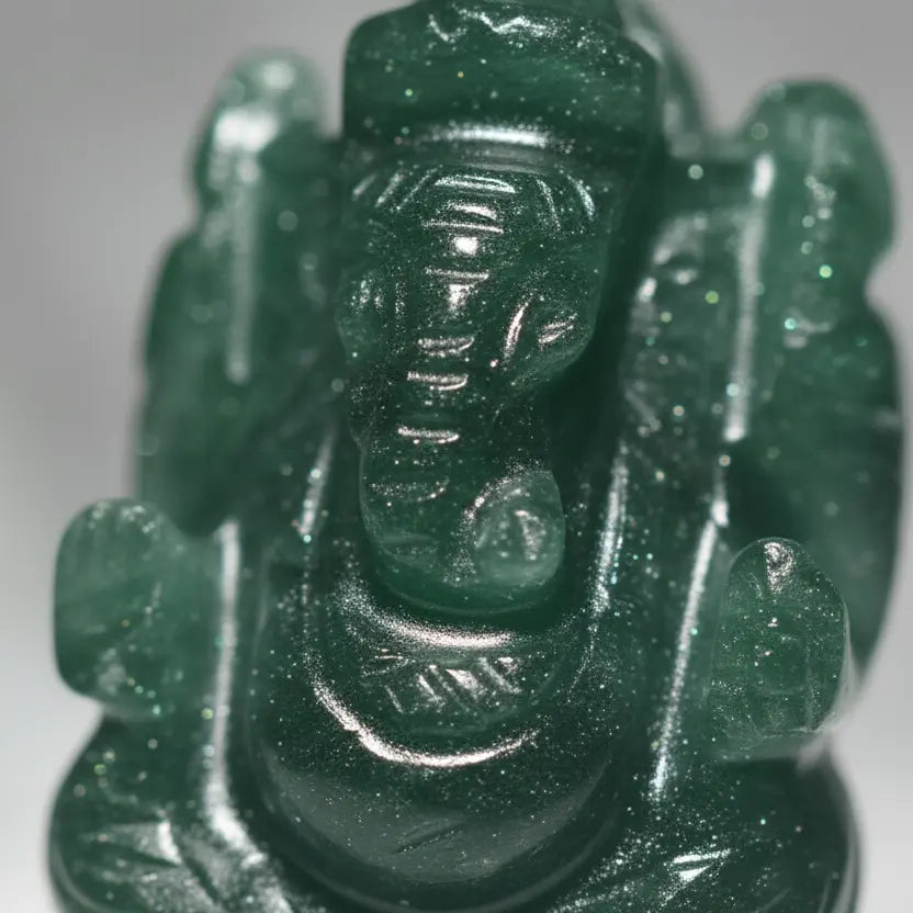 Macro close-up of natural green aventurine ganesha idol showing gemstone texture and carving details, ultra realistic gemstone photography, 4k
