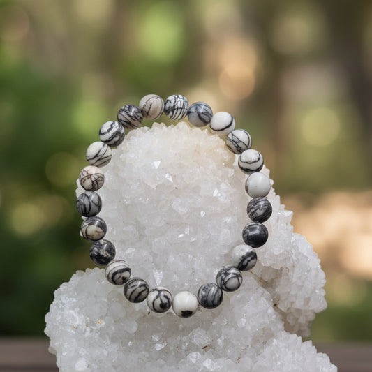 Natural Zebra Jasper gemstone with black and white stripes for balance and grounding
