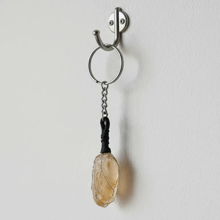 Unpolished raw citrine gemstone keychain used for prosperity, confidence, and success energy
